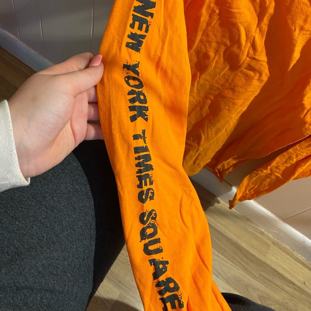 orange long sleeve shirt from an event in new york. size medium